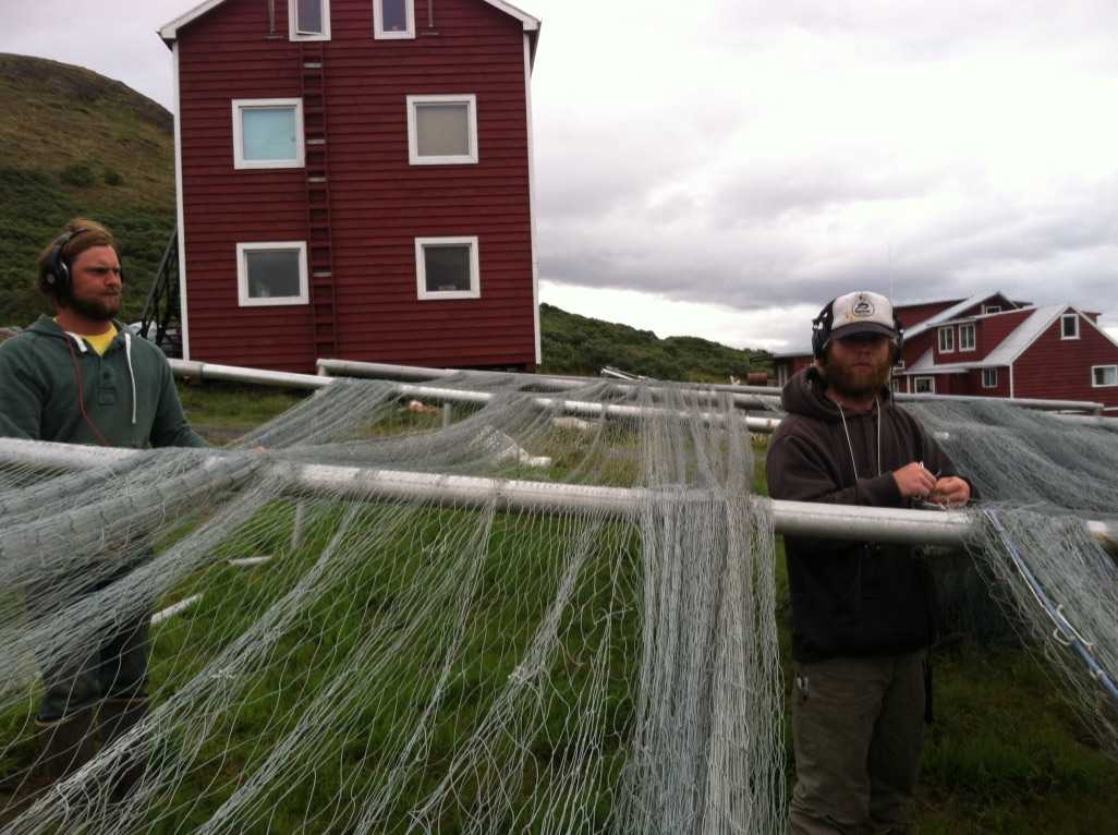 James and Luke mending nets